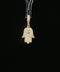 10K yellow gold Hamsa hand pendant with pavé diamonds and evil eye center