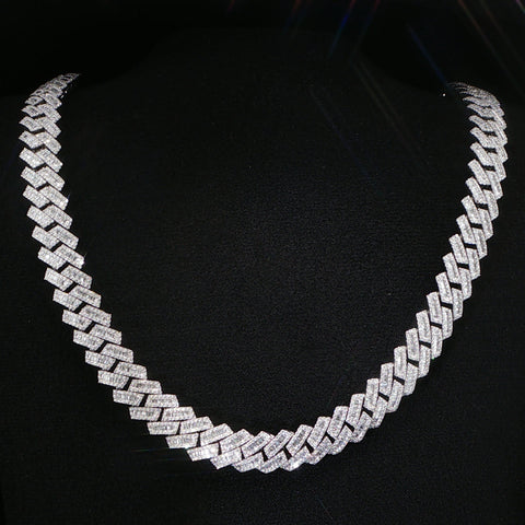 White gold Cuban link chain necklace with pavé round diamonds and baguette diamond accents on each link.