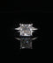 Diamond ring with a radiant-cut gemstone on a black background