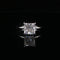 Diamond ring with a radiant-cut gemstone on a black background